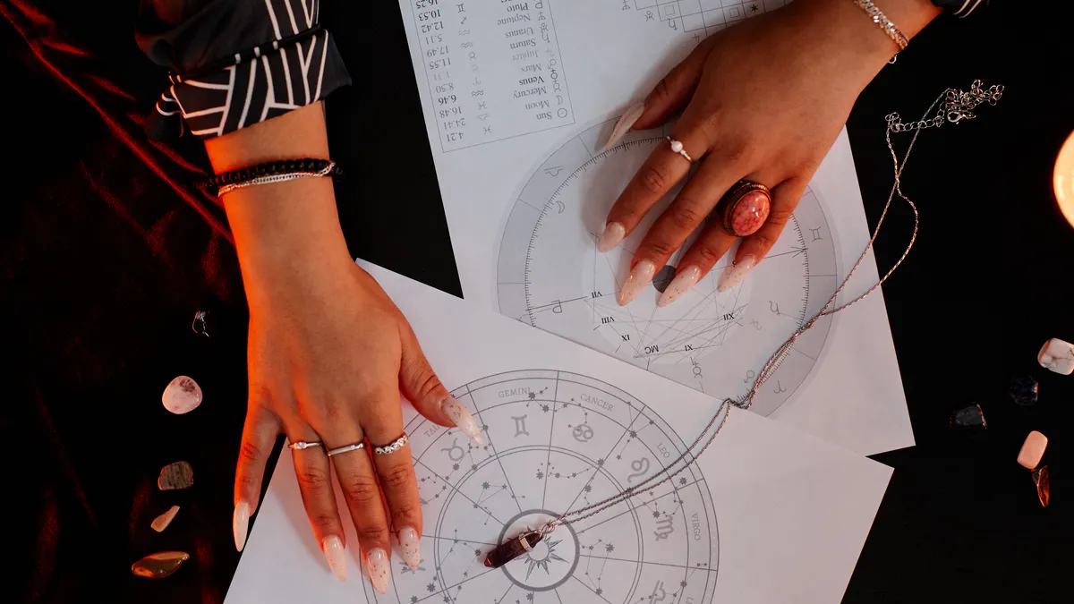 is now a good time to buy a house: hands reading astrology chart illustration